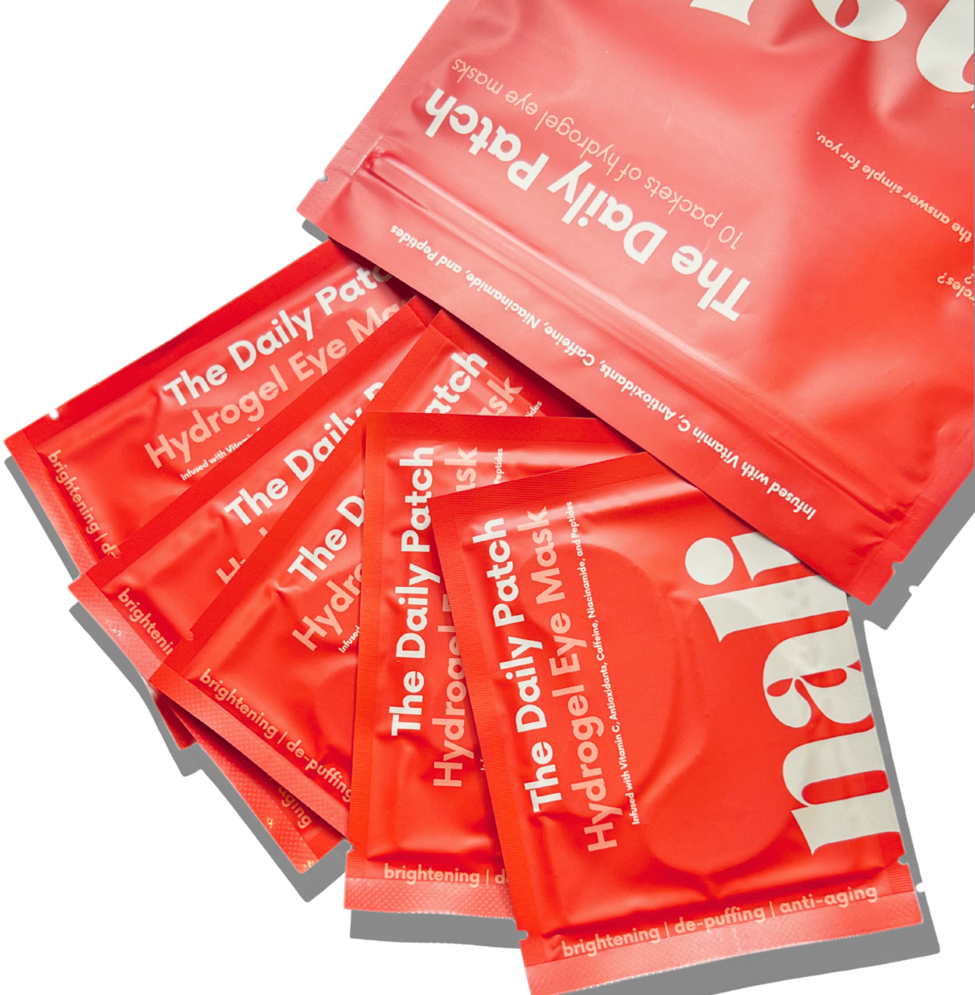 Red packets of 'The Daily Patch' Hydrogel Eye Mask on a white background